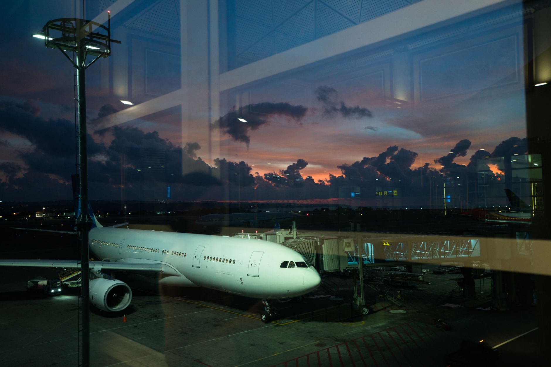 Aerial view of Heraklion Airport terminals and runways at sunset